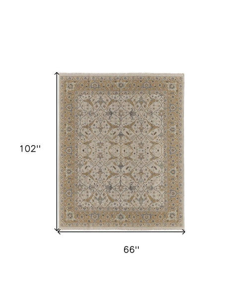 6' X 9' Ivory Gray and Tan Wool Oriental Hand Knotted Area Rug With Fringe
