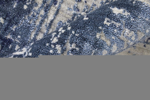 8' X 10' Blue and Ivory Abstract Hand Woven Worn Faded Area Rug