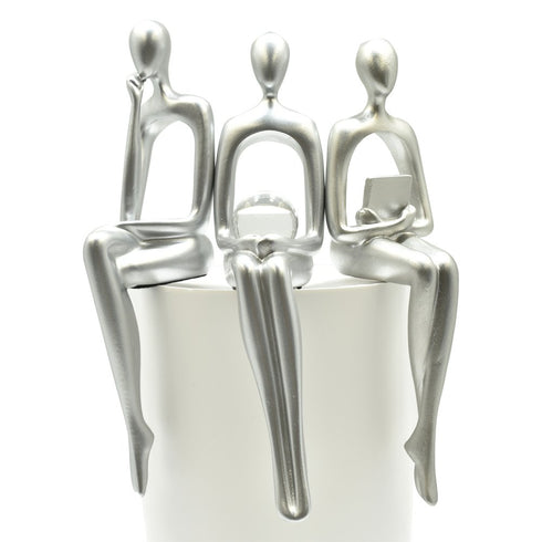 Set of Three Silver Resin People Tabletop Sculpture