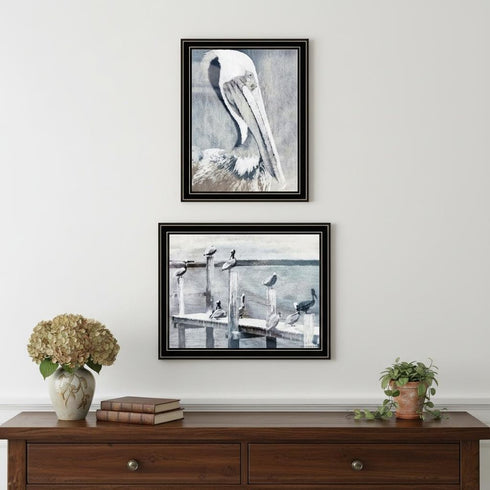 Set Of Two Pelican's on Pier Black Framed Wall Art