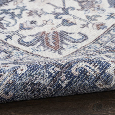 8' Blue Floral Power Loom Worn Faded Round Rug