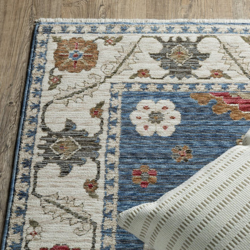8' X 11' Blue And Ivory Floral Area Rug With Fringe