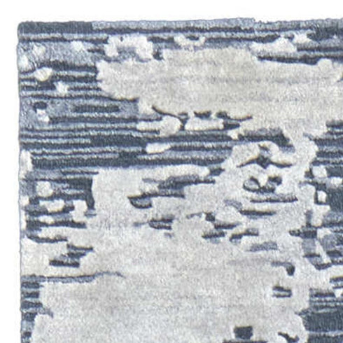 9' X 12' Blue And Ivory Abstract Hand Tufted Area Rug
