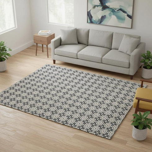 5' X 8' Black And Ivory Geometric Washable Area Rug With UV Protection