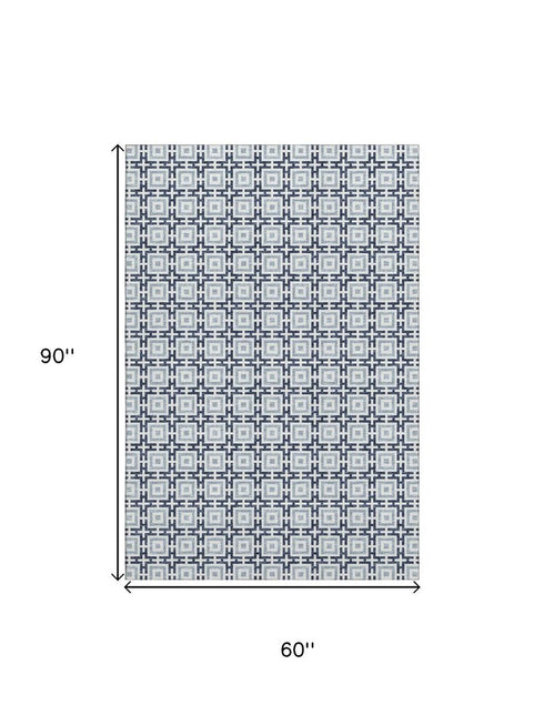5' X 8' Navy Blue And Ivory Geometric Washable Area Rug With UV Protection