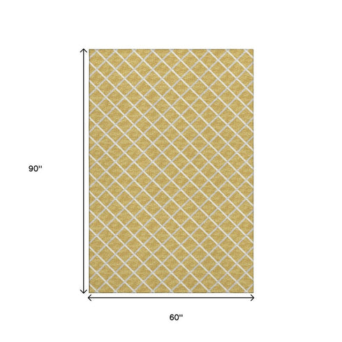 5' X 8' Gold And Ivory Geometric Washable Area Rug With UV Protection