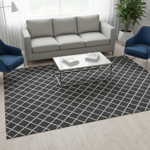 5' X 8' Black And Ivory Geometric Washable Area Rug With UV Protection