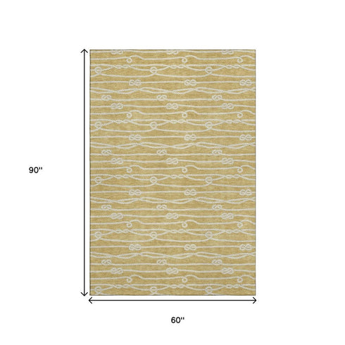 5' X 8' Gold And Ivory Nautical Washable Area Rug With UV Protection