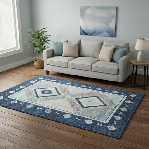5' X 8' Blue And Ivory Geometric Washable Area Rug With UV Protection