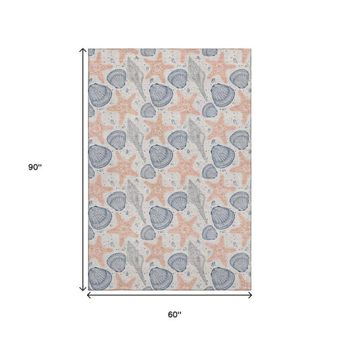 5' X 8' Peach Ivory And Navy Blue Geometric Washable Area Rug With UV Protection