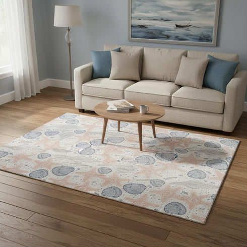 5' X 8' Peach Ivory And Navy Blue Geometric Washable Area Rug With UV Protection
