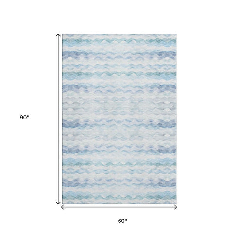 5' X 8' Blue And Ivory Geometric Washable Area Rug With UV Protection