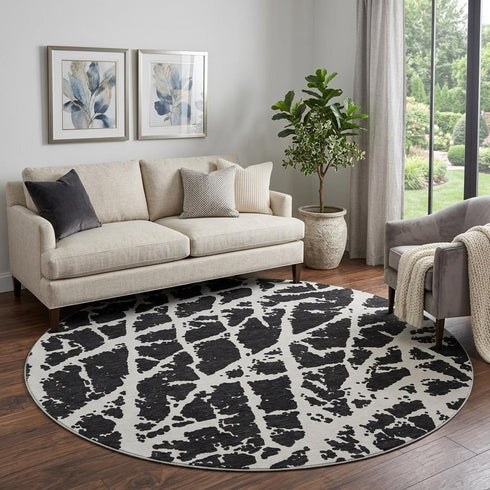 9' X 12' Black And Ivory Abstract Washable Area Rug With UV Protection
