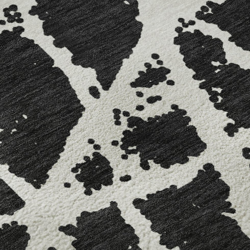 9' X 12' Black And Ivory Abstract Washable Area Rug With UV Protection