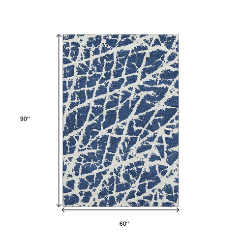 9' X 12' Navy Blue And Ivory Abstract Washable Area Rug With UV Protection