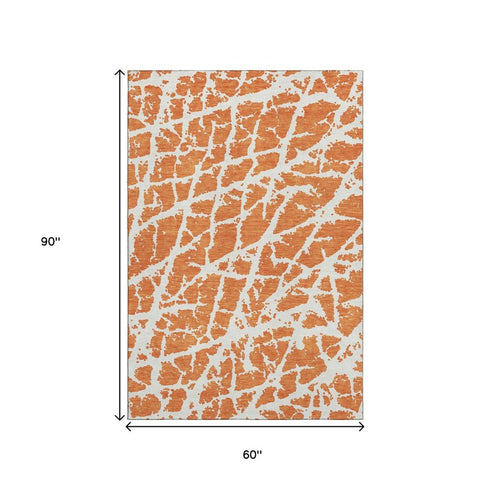 9' X 12' Orange And Ivory Abstract Washable Area Rug With UV Protection