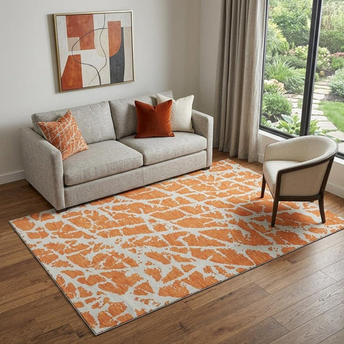 9' X 12' Orange And Ivory Abstract Washable Area Rug With UV Protection