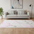 5' X 8' Pink And Ivory Abstract Washable Area Rug With UV Protection