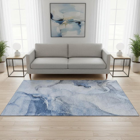 5' X 8' Blue And Ivory Abstract Washable Area Rug With UV Protection