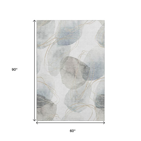 5' X 8' Ivory And Beige Abstract Washable Area Rug With UV Protection