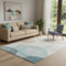 5' X 8' Beige Ivory And Teal Abstract Washable Area Rug With UV Protection