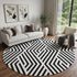 9' X 12' Black And Ivory Geometric Washable Area Rug With UV Protection