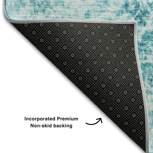 5' X 8' Teal And Ivory Abstract Washable Area Rug With UV Protection