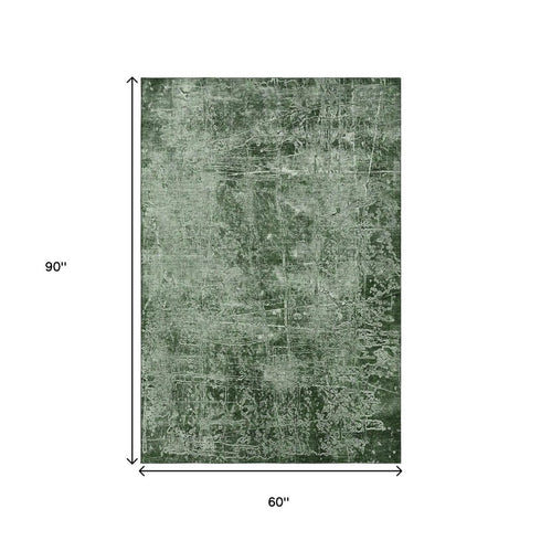 5' X 8' Emerald And Ivory Abstract Washable Area Rug With UV Protection