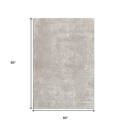 5' X 8' Ivory And Cream Abstract Washable Area Rug With UV Protection