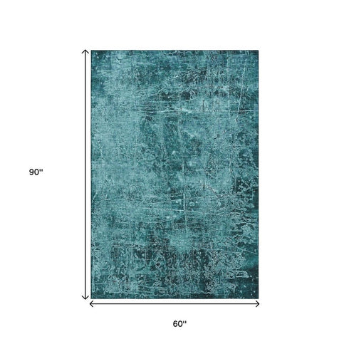 5' X 8' Teal And Ivory Abstract Washable Area Rug With UV Protection