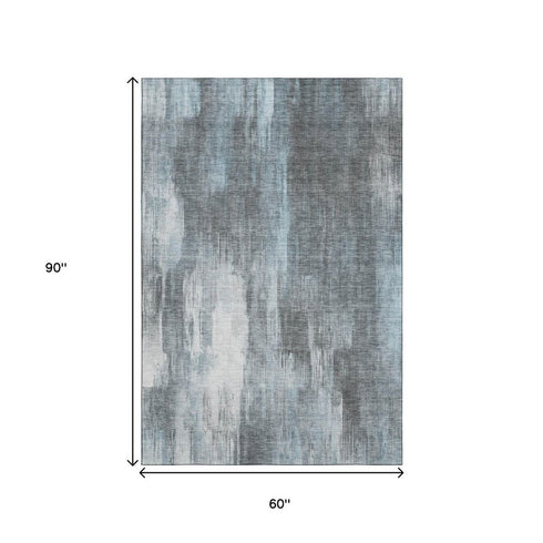 5' X 8' Teal And Ivory Abstract Washable Area Rug With UV Protection