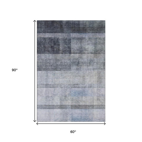 5' X 8' Navy Blue And Ivory Abstract Washable Area Rug With UV Protection