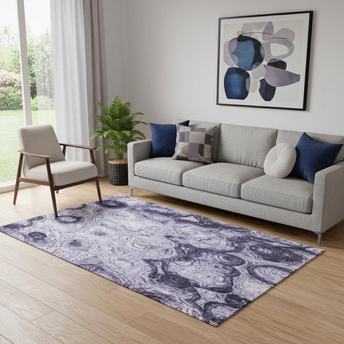 5' X 8' Purple And Ivory Abstract Washable Area Rug With UV Protection