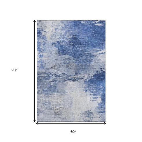 5' X 8' Blue And Ivory Abstract Washable Area Rug With UV Protection