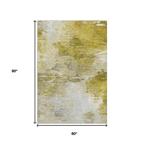5' X 8' Gold And Ivory Abstract Washable Area Rug With UV Protection