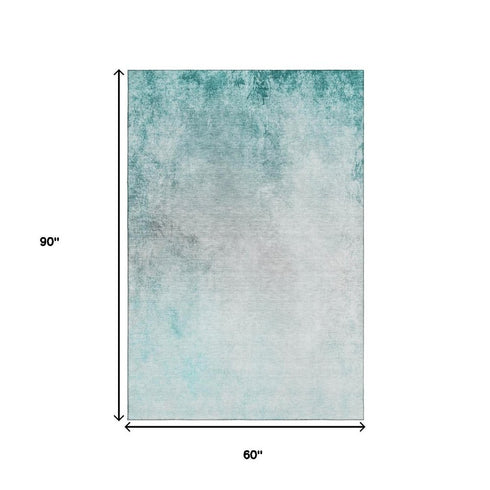 5' X 8' Teal And Ivory Abstract Washable Area Rug With UV Protection