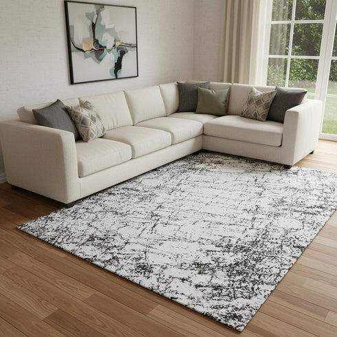 8' X 10' Black And Ivory Abstract Washable Area Rug With UV Protection