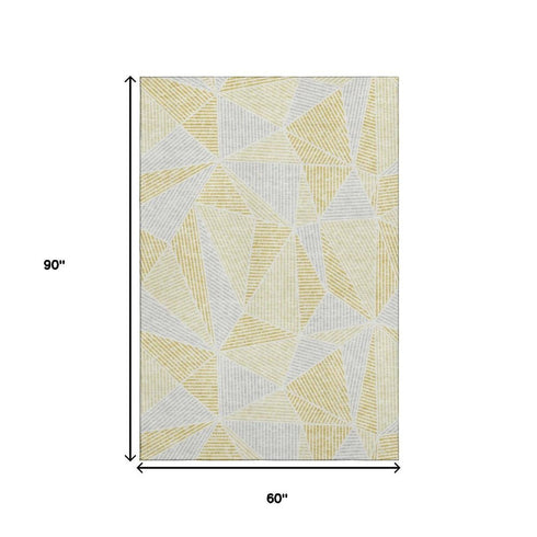 5' X 8' Gold And Gray Geometric Washable Area Rug With UV Protection