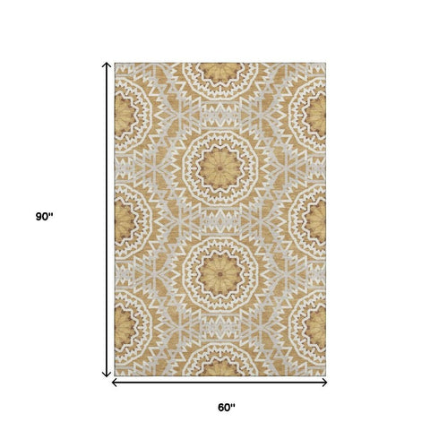 5' X 8' Gold And Ivory Geometric Washable Area Rug With UV Protection