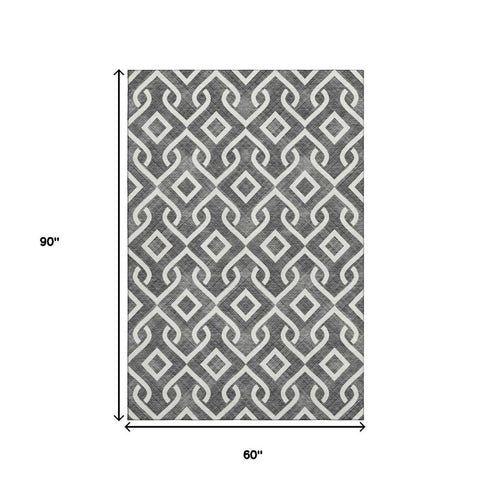 5' X 8' Black And Ivory Geometric Washable Area Rug With UV Protection