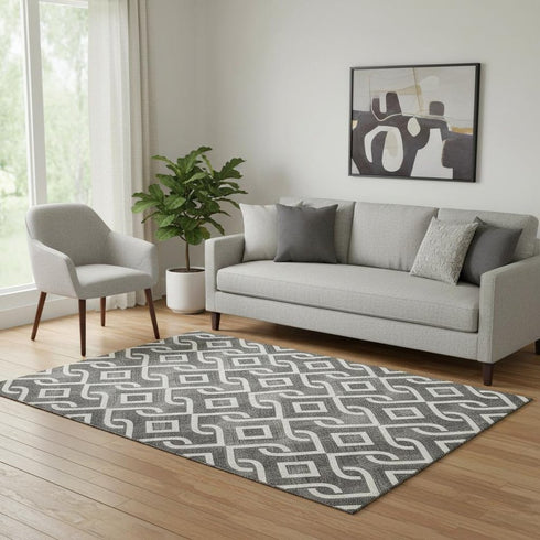 5' X 8' Black And Ivory Geometric Washable Area Rug With UV Protection