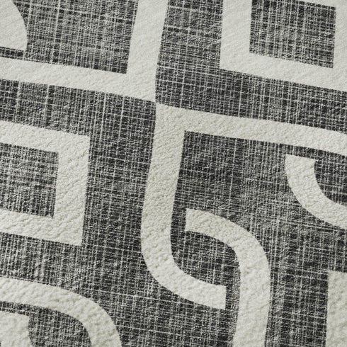8' X 10' Black And Ivory Geometric Washable Area Rug With UV Protection