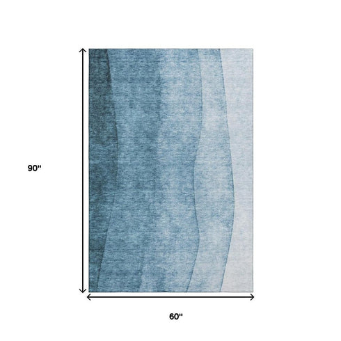 5' X 8' Blue And Ivory Ombre Washable Area Rug With UV Protection
