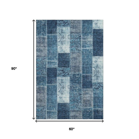 5' X 8' Blue And Ivory Patchwork Washable Area Rug With UV Protection