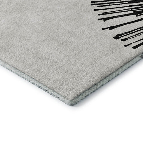 5' X 8' Black And Ivory Abstract Washable Area Rug With UV Protection