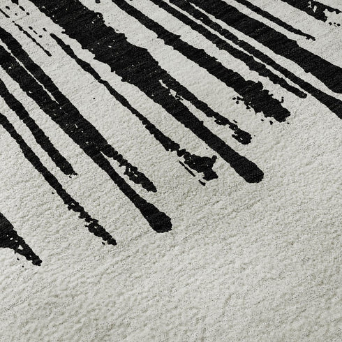 5' X 8' Black And Ivory Abstract Washable Area Rug With UV Protection