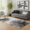 5' X 8' Black And Ivory Abstract Washable Area Rug With UV Protection