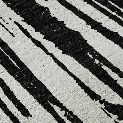 5' X 8' Black And Ivory Abstract Washable Area Rug With UV Protection