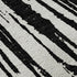 5' X 8' Black And Ivory Abstract Washable Area Rug With UV Protection