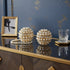 Set of Two Gold Ivory And Pearl Faux Crystal And Metal Decorative Orbs